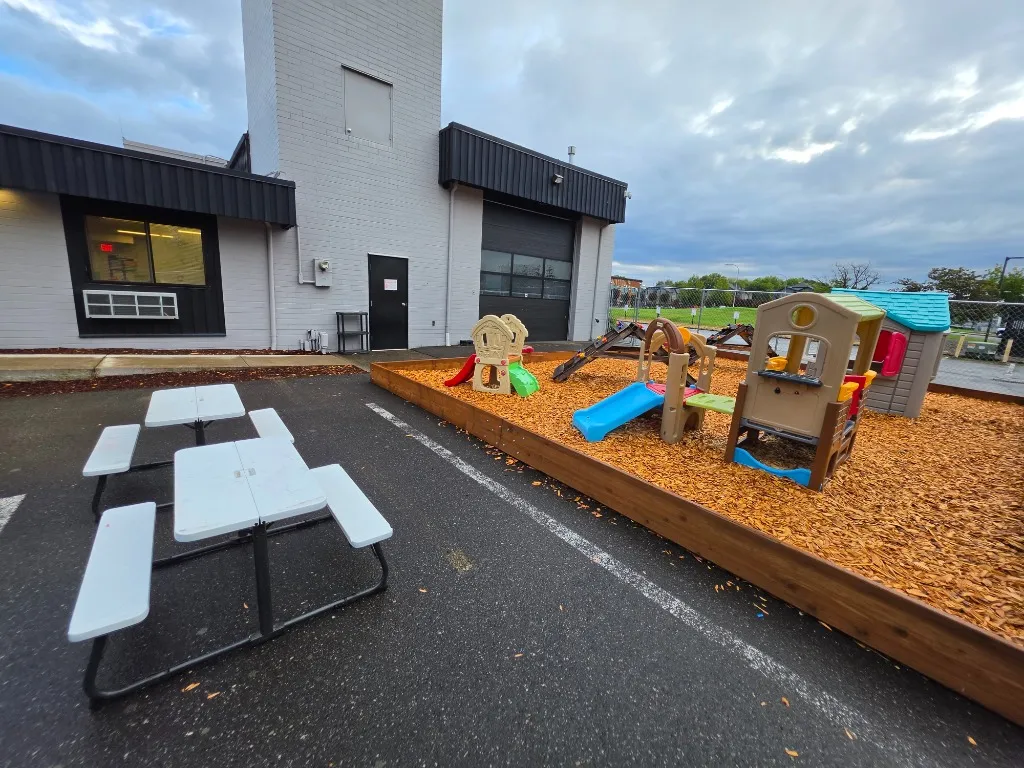 Harwell School Beaverton fenced outdoor playground with slides and play structures